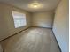 Simple bedroom with carpet flooring and a window with blinds at 2084 S Rifle St, Aurora, CO 80013