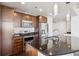 Modern kitchen with stainless steel appliances and dark countertops at 891 14Th St # 3108, Denver, CO 80202
