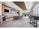 Community room with kitchen, seating area, and large screen at 891 14Th St # 3108, Denver, CO 80202