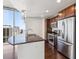 Modern kitchen with stainless steel appliances and breakfast bar at 891 14Th St # 3108, Denver, CO 80202