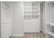 Large walk-in closet with built-in shelving and drawers at 891 14Th St # 3108, Denver, CO 80202