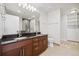 Bathroom with double sinks, granite countertop and walk-in shower at 891 14Th St # 3108, Denver, CO 80202