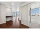 Modern entryway with hardwood floors and frosted glass partition at 891 14Th St # 3108, Denver, CO 80202