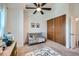 bedroom with crib, closet, and rug at 1109 S Waco St # E, Aurora, CO 80017