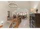 Open hallway with a view of the dining room and staircase at 12963 Silver Elk Ln, Littleton, CO 80127