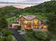 Luxury home on a hill with beautiful landscaping at 12963 Silver Elk Ln, Littleton, CO 80127