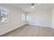 Spacious bedroom featuring neutral walls and wood-look floors at 6493 Barnacle Ct, Boulder, CO 80301