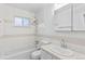 Clean bathroom with a shower/tub combo and updated fixtures at 9868 Appletree Pl, Thornton, CO 80260