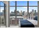 Bedroom with city view and large windows at 1700 Bassett St # 1901, Denver, CO 80202