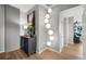 Bright entryway with hardwood floors, modern light fixture, and stylish console table at 1700 Bassett St # 1901, Denver, CO 80202