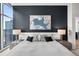 Main bedroom with ensuite bathroom access and city views at 1700 Bassett St # 1901, Denver, CO 80202