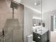Modern bathroom with glass shower and vanity at 1700 Bassett St # 1901, Denver, CO 80202