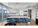 Modern kitchen with marble countertops and blue barstools at 1700 Bassett St # 1901, Denver, CO 80202