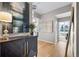 Modern entryway with hardwood floors, artwork, and stylish console table at 1700 Bassett St # 1901, Denver, CO 80202