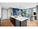 Open concept kitchen with marble island and city views at 1700 Bassett St # 1901, Denver, CO 80202