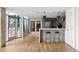 Modern community kitchen with breakfast bar and stainless steel appliances at 1700 Bassett St # 1901, Denver, CO 80202