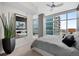 Bright bedroom with large windows and city views at 1700 Bassett St # 1901, Denver, CO 80202