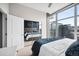 Bright bedroom with mirrored closet doors and city view at 1700 Bassett St # 1901, Denver, CO 80202