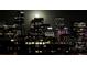 Night time view of city skyline with a bright moon at 1700 Bassett St # 1901, Denver, CO 80202