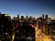 Nighttime aerial view showcasing city skyline and urban landscape at 1700 Bassett St # 1901, Denver, CO 80202