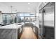 Modern kitchen with stainless steel appliances and city views at 1700 Bassett St # 1901, Denver, CO 80202