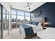 Main bedroom with city views and ceiling fan at 1700 Bassett St # 1901, Denver, CO 80202