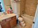 Clean bathroom with tub, toilet and vanity at 8802 E 24Th Pl # 101, Denver, CO 80238