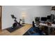 Home office with desk, chair, and exercise bike at 2362 S Troy St, Aurora, CO 80014