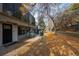 Pathway leading to townhome with autumn leaves and landscaping at 2362 S Troy St, Aurora, CO 80014