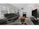 Spacious living room with comfortable seating and large TV at 2362 S Troy St, Aurora, CO 80014