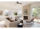 Spacious living room featuring a fireplace and large windows at 16113 W 14Th Ave, Golden, CO 80401