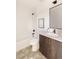 Modern bathroom with updated vanity, bathtub, and geometric tile floor at 16113 W 14Th Ave, Golden, CO 80401