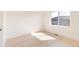 Light-filled bedroom with hardwood floors and large window at 16113 W 14Th Ave, Golden, CO 80401