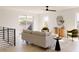 Bright living room with large windows, hardwood floors, and comfy seating at 16113 W 14Th Ave, Golden, CO 80401
