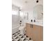 Clean bathroom featuring a large mirror and modern vanity at 16113 W 14Th Ave, Golden, CO 80401