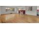 Spacious living room featuring hardwood floors and a brick fireplace at 577 96Th St, Louisville, CO 80027