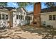 Backyard view showing patio, brick structure, and house exterior at 577 96Th St, Louisville, CO 80027