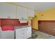 Needs updating, this kitchen offers a retro look with yellow walls at 577 96Th St, Louisville, CO 80027