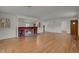 Bright living room with hardwood floors, fireplace and view to other rooms at 577 96Th St, Louisville, CO 80027