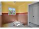 Small retro kitchen with yellow walls and brown tile at 577 96Th St, Louisville, CO 80027