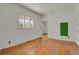 Hardwood floor bedroom with access to another room at 577 96Th St, Louisville, CO 80027