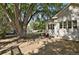 Large backyard with mature trees and a patio area at 577 96Th St, Louisville, CO 80027