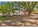 Large backyard with mature trees and a brick patio at 577 96Th St, Louisville, CO 80027
