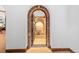 Ornate brick wine cellar entrance with large clay pot at 7944 Dante Dr, Littleton, CO 80125