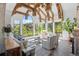 Bright living room features hardwood floors, vaulted ceilings with exposed beams, and views at 7944 Dante Dr, Littleton, CO 80125
