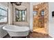 Spa-like bathroom with a freestanding tub and a walk-in shower at 7944 Dante Dr, Littleton, CO 80125