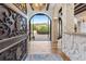 Elegant entryway with ornate door and views to backyard oasis at 7944 Dante Dr, Littleton, CO 80125