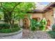 Inviting courtyard with lush greenery and a central fountain at 7944 Dante Dr, Littleton, CO 80125