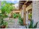 Brick courtyard with lush landscaping and tranquil fountain at 7944 Dante Dr, Littleton, CO 80125