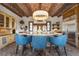 Gourmet kitchen features granite island, custom cabinetry, and high-end appliances at 7944 Dante Dr, Littleton, CO 80125